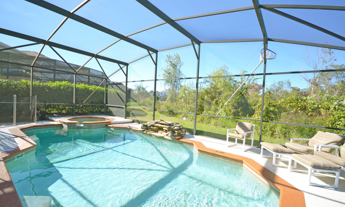 Windwood Bay House | Private pool with waterfall feature. Popular 4 bed, 3 bath villa in Windwood Bay