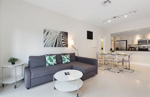 Windsor Hills Condo | Modern condo in resort, 5 min to Disney. WiFi, water slides, pool, arcade!