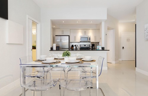 Windsor Hills Condo | Modern condo in resort, 5 min to Disney. WiFi, water slides, pool, arcade!