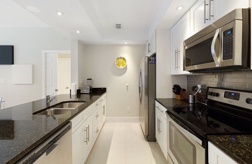 Windsor Hills Condo | Modern condo in resort, 5 min to Disney. WiFi, water slides, pool, arcade!