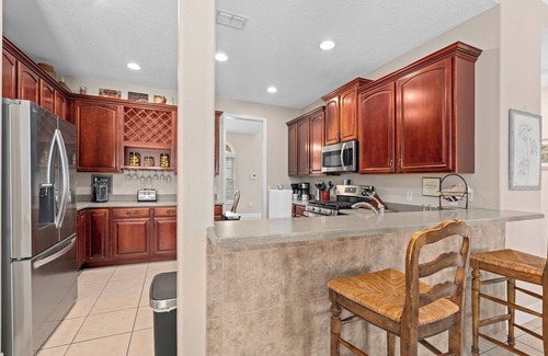 West Kissimmee House | South Facing Pool Hot Tub Themed Rooms Home Theater Swingset Splash Pad BBQ