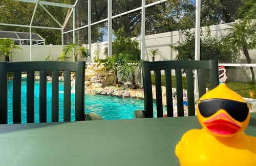 Chatham Park House | 3 Bedroom Home with Private Screened Pool with Rock Waterfall Feature and Gameroom by Florida Dream.