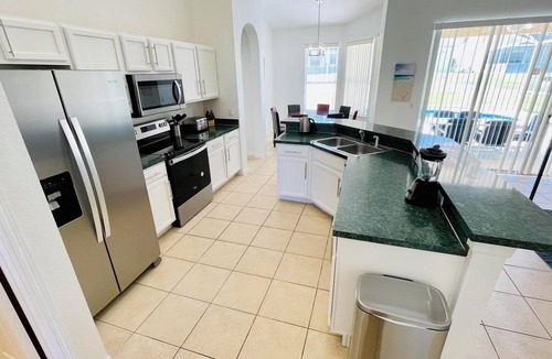 Highlands Reserve House | Ample space and modern elegance await at this 5/3 Pool Home located at Highlands Reserve Golf and Country Club
