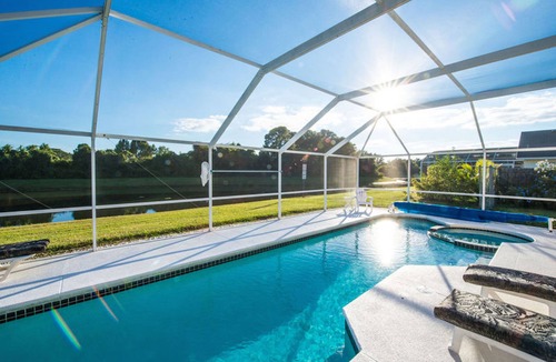 Windward Cay Villa | Florida Villa Lake Side View with 36ft South facing Pool & Spa in Windward Cay