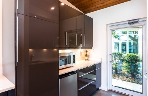 Audubon Park House | Hip RetroModern Lakefront Cabana with EV Charging Station