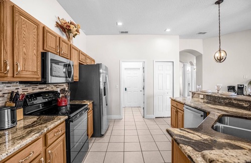 Buena Ventura Lakes House | Upstay - Waterside Home With Pool and Hot Tub