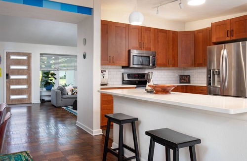 Northeast Orlando House | Vibrant Orlando Lakefront Cat Lover's Retreat with Pool & Gardens