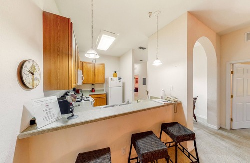 Bahama Bay Condo | Welcoming ground-floor condo with patio, pool, fitness center, sauna, & hot tub