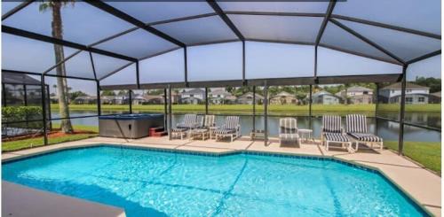 Lake Berkley House | Sunny South Facing Pool with Hot Tub and Lake View Near Disney